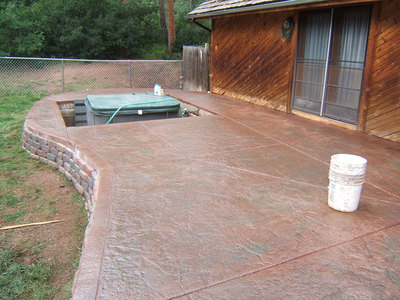 stamped concrete patio with hot tub
