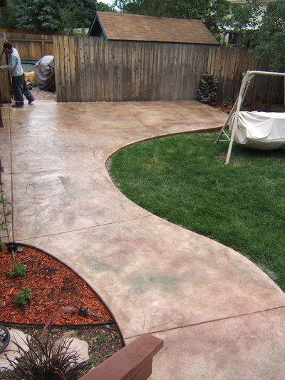 custom curved stamped concrete patio and walkway