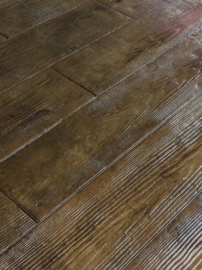 Stamped concrete with a polished wood floor look
