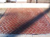 stenciled concrete with brick look in driveway